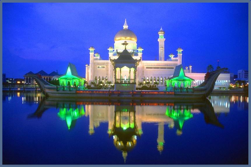 BWN Brunei Bandar Seri Begawan Omar Ali Saifuddien Mosque with stone boat and lagoon by night b